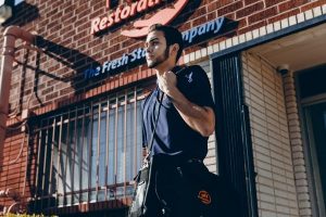 water damage restoration professional in front of 911 office