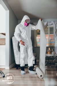 disaster restoration professional working in a home